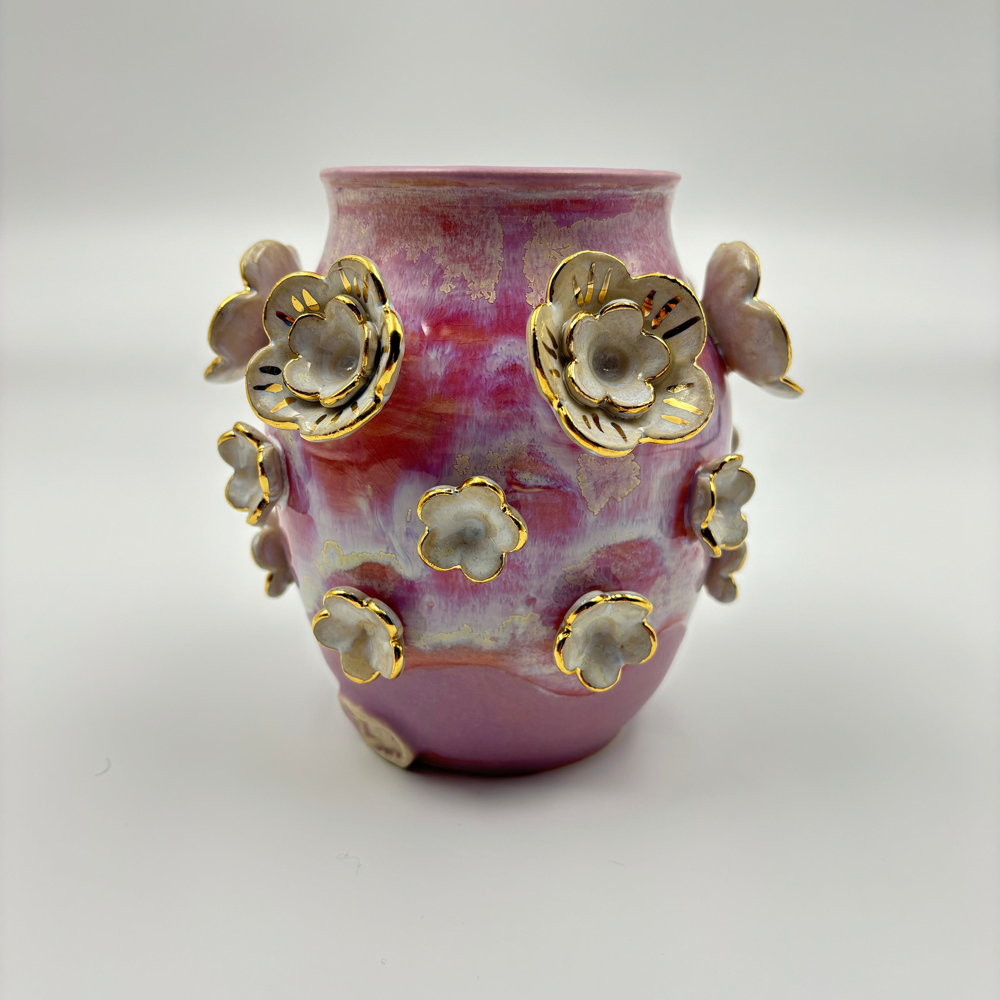 white and gold flower vase